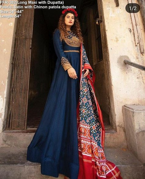 Patola is just timeless Fashion! We come up with heavy gold embroidery navy blue maxi dress paired with unique patola printed dupatta! Maxi is stiched with fully boutique fit and canvas border to get flarry tale look!  Code: FFR-382 Price: 1625/- Ikat Dresses, Silk Patola Saree, Ikat Dupatta, Patola Sarees, Navy Blue Maxi Dress, Famous Dress, Dress Name, Lehenga Blouse Designs, Ikat Dress