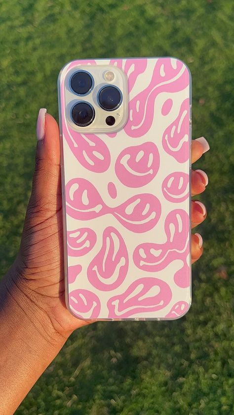 This stylish, pastel pink phone case features a groovy, dripping melting smiley face design in white and pink. Constructed from TPU, it provides a soft yet durable protective layer for your device. Smiley Phone Case, Preppy Iphone Case, Preppy Phone, Clear Phone Case Design, Phone Case Ideas, Preppy Phone Case, Pink Phone Case, Phone Things, 12 Pro Max Iphone