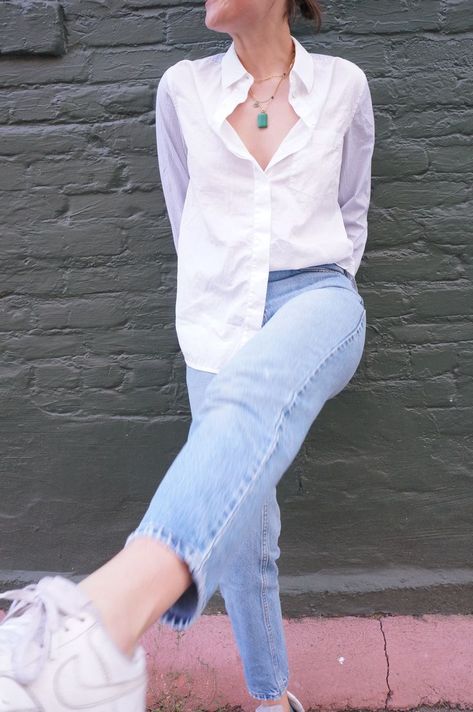 Cute button down shirt outfit paired with light wash jeans and white sneakers. #falloutfit #outfit #clothing #buttondown #nike #whitesneakers #trending Light Jeans And White Shirt Outfit, White Shirt And Jean Photoshoot, Blue Jeans White Shirt Aesthetic, Blue Jeans White Shirt Photoshoot, White Shirt Photoshoot Women Aesthetic, Jeans White Shirt Maternity Shoot, Light Blue Jeans Outfit, Oversized Shirt Outfit, Oversized White Shirt