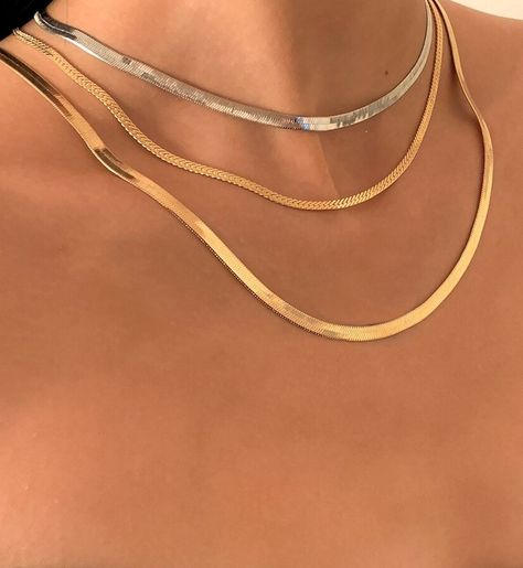 Delicate, three tier, flat style herring bone necklace from Olivia Divine.Gold and silver tone, three piece, graduated style necklace.Can be worn separately, or all together to achieve a layered style look.All adjustable length.Perfect for holidays, casual drinks and everyday wear. Gold And Silver Necklaces Layered, Silver And Gold Necklace Layering, Bracelet Stacks, Layered Style, Preppy Jewelry, Graduation Style, Bone Necklace, Layered Necklaces Silver, Herringbone Necklace