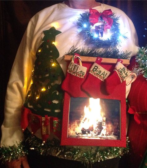 Ugly sweater; live fireplace ( using iPad app for fireplace) Fireplace Christmas Sweater, Creative Ugly Christmas Sweater, Ugly Sweater Ideas, Homemade Ugly Christmas Sweater, Ugly Christmas Sweater Ideas, Ugly Christmas Sweater Diy Funny, Ugly Christmas Sweater Outfit, Tacky Christmas Party, Diy Christmas Sweater