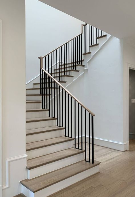 another simple example. iron railing with wooden top. Minimalist Handrail Stair Railing, Metal Railing With Wood Handrail, Black Steel Stair Railing, Vertical Black Metal Stair Railing, Stairs Wooden Railing, Simple Railing Design, Iron Railing Stairs, Minimal Staircase, Wall Mirror Decor Ideas