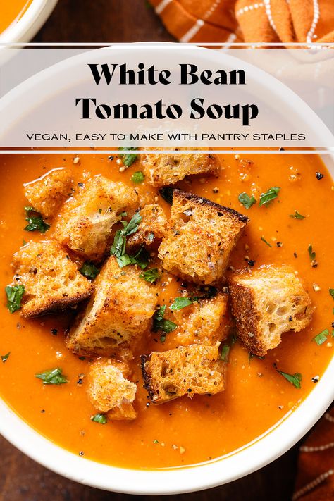 This White Bean Tomato Soup is vegan, gluten-free, and made with all pantry staples. The soup is thickened with white beans so there's no need for cream. The beans add a ton of protein and make the soup more filling. Serve it on its own with a drizzle of vegan yogurt or sour cream, or with grilled cheese or toasted bread. White Bean Soup With Tomatoes, Vegan Cream Of Tomato Soup, Soup Recipes White Bean, Tomato Soup With Beans, Roasted Tomato And White Bean Soup, Slow Cooker Fire Roasted Tomato And White Bean Soup, Tomato Soup With White Beans, White Bean Soups, White Bean Tomato Soup