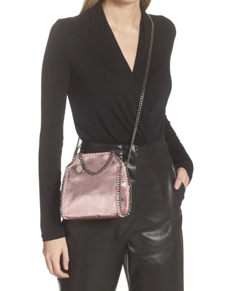 Pink Crossbody Bag Stella McCartney Falabella Tiny Metallic Pink Crossbody Bag with Silver Chain Straps #StellaMcCartney #StellaMcCartneyBags #FalabellaBag #PinkBags #CrossbodyBags #SmallBags #DesignerBags #DressyBags #FormalBags #MetallicBags #ChainDetail #BrandDirectory #EthicalFashion #WheretoShop Metallic Bag Outfit, Mini Bag Outfit, Stella Mcartney, Stella Bag, Comfy Jeans Outfit, Handbag Care, Falabella Bag, Tiny Bag, Stella Mccartney Falabella