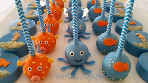 Under the Sea cake pops, Chocolate dipped Oreo's and Fish Cupcake cake Fish Cupcake Cake, Under The Sea Cake Pops, Fish Cake Pops, Cake Pops Chocolate, Themed Cake Pops, Fishing Cupcakes, Under The Sea Cake, Ocean Birthday Party, Shark Themed Birthday Party