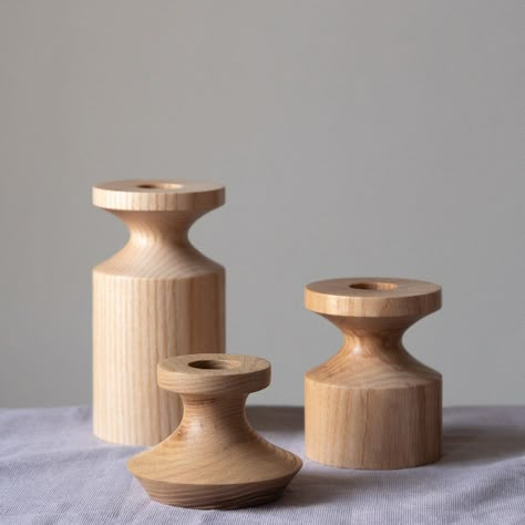 Each contemporary candlestick is turned from a single piece of British Ash, known for it’s striking grain and finished in a hardwearing wax and oil blend Product dimensions (approx) - Height 11.5cm Diameter 6cm Central hole fits a standard 7/8ths inch dinner candle. FEATURES CONTEMPORARY WOODEN TABLEWARE BY SELWYN HOUSE HANDMADE IN DERBYSHIRE FROM BRITISH-GROWN TIMBERS TRADITIONAL CRAFT METHODS Candlestick Wood, Wooden Candlestick, Lathe Projects Woodturning, Woodturning, Turned Candle Holders, Turned Candlesticks, Wooden Candle Stand, Wooden Tableware, Woodturning Art