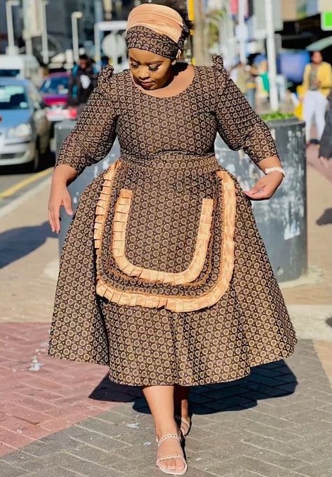 Makoti Dresses African Women, Brown Shweshwe, Xhosa Makoti Outfits, Pedi Dresses, Shweshwe Dresses For Makoti, Sotho Traditional Dresses, Africa Traditional, Dress With Apron, South African Traditional Dresses