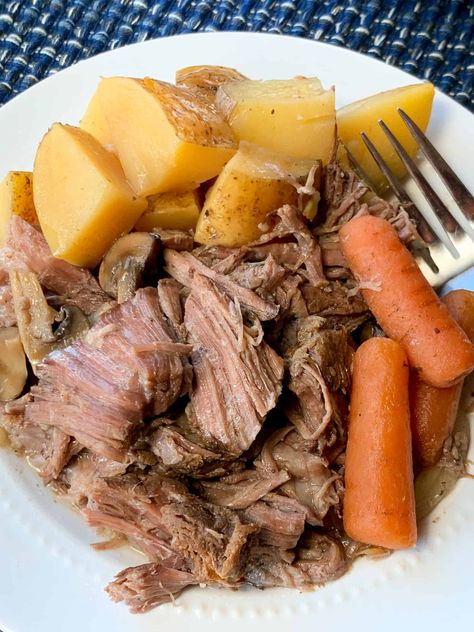 Plate of shredded beef pot roast with potatoes and veggies Easy Crockpot Pot Roast, Roast Beef Crock Pot Recipes, Crockpot Pot Roast, Tip Roast, Slow Cooker Pot Roast, Sirloin Tip Roast, Mini Carrots, Beef Pot Roast, Pot Roast Slow Cooker