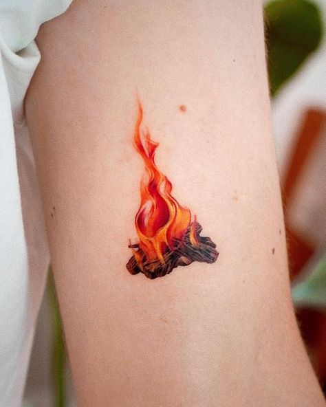 Young Chicken 영치킨 on Instagram: "Campfire🔥 . Thank you Jamie! Hope you enjoyed camping with your new tattoo😁 . @youngchickentattoo #youngchickentattoo #영치킨타투" Carry The Fire Tattoo, Flowers And Fire Tattoo, Small Campfire Tattoo, Fire Related Tattoos, Campfire Tattoo Ideas, Cool Colored Tattoos, Fire Tattoo Realistic, Realistic Fire Tattoo, Simple Fire Tattoo