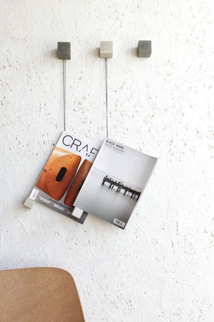 A modern concrete and backer twine magazine wall display diy Magazine Holders Diy, Wall Magazine, Diy Magazine Holder, Printed Concrete, Magazine Display, Concrete Home Decor, Magazine Wall, Newspaper Holder, Woodwork Ideas