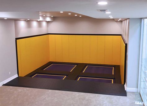 Bring the heart pumping entertainment of a trampoline park to your indoor play space. Inspired by trampolines found at family entertainment centers, our team helped this homeowner incorporate a trampoline court into his newly built recreation room. Custom designed for his space, we incorporated premium grade wall pads, purple trampoline beds with yellow stripes and a durable frame pad that protects kids from the trampoline springs and frame. Indoor Play Space, Trampoline Ideas, Sunken Trampoline, Rectangle Trampoline, Indoor Playground Design, Trampoline Springs, Trampoline Room, Indoor Playroom, Recreation Room