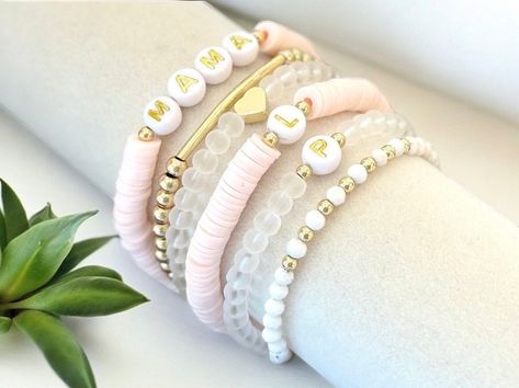 Custom Light Pink Friendship Stretchy Stackable Beaded Bracelets & Gold Filled Howlite Frosted Glass Accent Bracelets Personalize yours on Etsy @LilyBeadCompany   #trendingbracelet #trendingfashion #fashion #popularbracelet #instagood #style #ootd #instafashion #jewelry #fashionblogger #fashionstyle #fashionaddict #styleinspo #trends #stylish #outfitoftheday #instastyle #fashiontrends #handmade #gemstonejewelry #customjewelry #statementjewelry #etsyjewelry #goldjewelry #jewelrylovers #beadedjewelry #beauty #stylish #jewelryshop #jewelrydesigner #jewelrygifts #jewelryboutique #jewelryjunkie #handmadejewelry #bracelet #beads #customjewelry #womensjewelry Bracelets With Initials, Beaded Bracelets Pink, Kids Name Bracelet, Pink Word, Bracelet Clay, Word Bracelets, Keep Bracelet, Stackable Beaded Bracelets, Heishi Bracelets