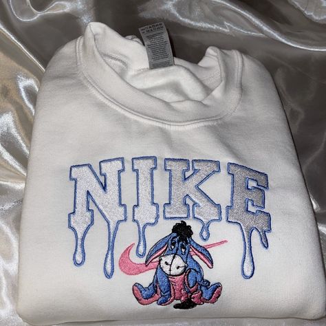 Custom Eeyore Sweatshirt In White! Embroidery Made. *Not Associated With Any Brand* Cute Fall Sweatshirt Designs, Nike Sweatshirts Women, Iron On Sweatshirt, Nike Embroidery Sweatshirt, Disney White Sweatshirt With Cartoon Print, Bluey Nike Sweatshirt, Winnie The Pooh Crewneck Nike, Eeyore Embroidery, White Disney Character Print Sweatshirt