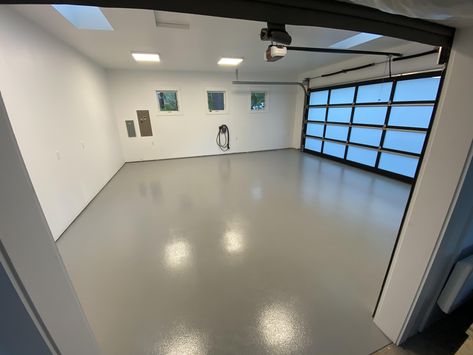 This 500 ft² garage floor is coated in a single pigment epoxy with added matting agent for a less glossy sheen and added traction.  #northwestepoxycoating #epoxyfloor #garagefloor #epoxy Garage Epoxy Floor, Epoxy Garage Floor, Epoxy Garage Floor Colors, Shiny Garage Floor, Grey Epoxy Garage Floor, Clean Garage Floor, Matte Epoxy Floor, Epoxy Flake Garage Floor, Apoxsee Garage Floors