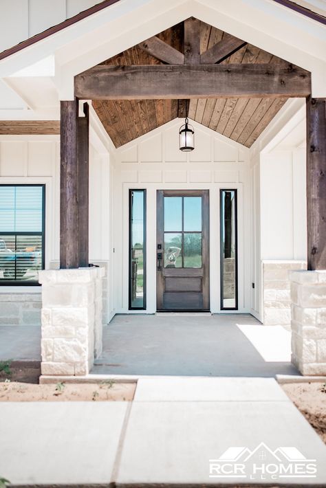 Wrapped Pillars Front Porches, White Exterior House Ideas, Barndominium Exterior Doors, Modern Portico Entrance, White Barndominium Exterior With Stone, Vaulted Front Porch Entry, Farmhouse With Stone Accents, Barndominium Colors Exterior, White Barndominium Exterior