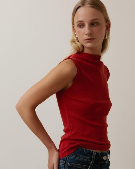 Sleeveless mock neck top in Poppy red. Cut from soft pointelle jersey. Lyocell and organic cotton. #afterallstudio #afterall #soft #tshirt #jersey #organiccotton #lyocell Shirt Silhouette, Sleeveless Mock Neck, Poppy Red, Mock Neck Top, Red Poppies, Mock Neck, Smocking, Poppies, Girl Fashion