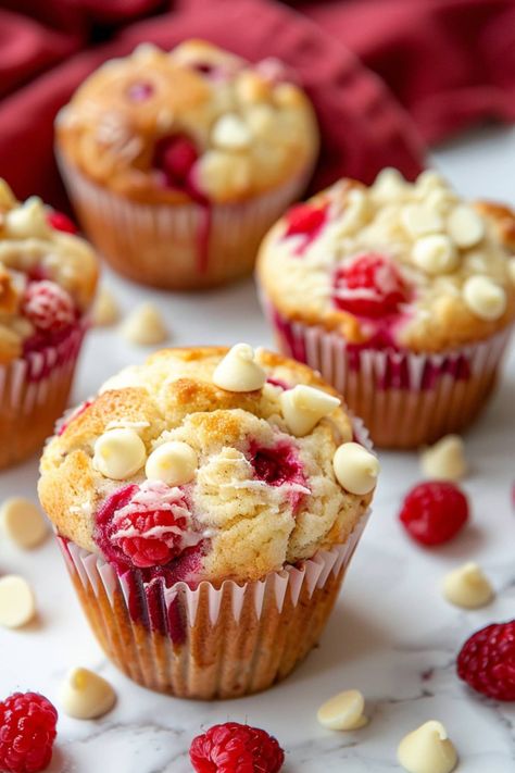 These white chocolate raspberry muffins are an ideal treat for any time of the day. Between the juicy berries and creamy chocolate, they're insanely good. White Chocolate And Raspberry Muffins, White Chocolate Raspberry Muffins, Raspberry White Chocolate Muffins, Chocolate Raspberry Muffins, Gathering Recipes, Raspberry Cupcake Recipes, Ripple Cake, Choc Muffins, Raspberry And White Chocolate Muffins