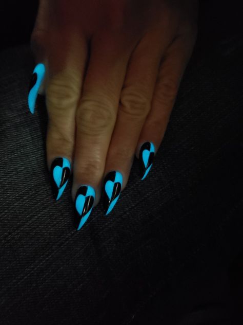 Blue glow in dark acrylic nails with black paint. Dark Teal And Black Nails, Neon Blue And Black Nails, Short Dark Purple Acrylic Nails Design, Short Glow In The Dark Nails, Blue Glow In The Dark Nails, Black And Light Blue Nails, Black And Blue Acrylic Nails, Black And Blue Nails Acrylic, Halloween Nails Blue