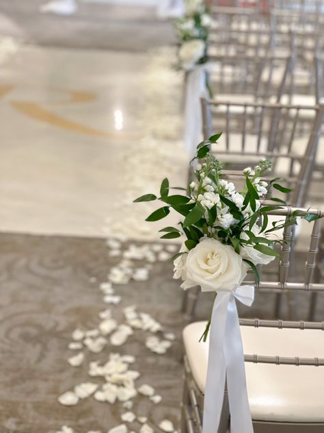 White and green wedding aisle chair flowers Diy Chair Flowers Wedding, Bench Isle Decorations Wedding, White Aisle Flowers Wedding, Isle Chair Decor Wedding, Wedding Aisle White Flowers, Flowers For Aisle Wedding, Ceremony Chair Flowers, Outdoor Aisle Decor, Simple Aisle Decorations Wedding