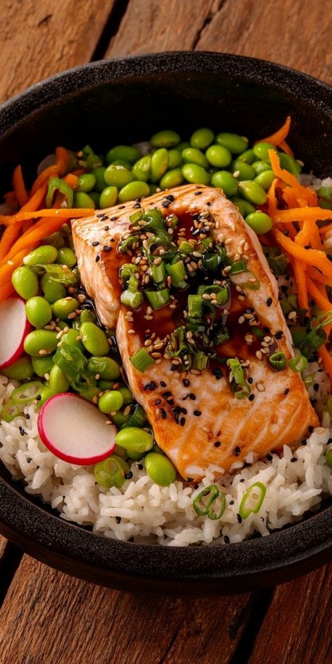 Delight in this Savory Salmon Rice Bowl, a perfect blend of tender salmon, fluffy rice, and vibrant veggies! This meal is not just delicious but also healthy, featuring edamame, carrots, and radishes. Topped with a flavorful sauce and sesame seeds, it’s an easy recipe that’s perfect for weeknight dinners. Join me in creating this delightful dish! Salmon Meals Aesthetic, Salmon Rice Salad, Carrots And Radishes, Savory Salmon, Homemade Banana Pudding Recipe, Rice Bowl Recipe, Grilled Halibut, Salmon Rice Bowl, Lunch Bowls