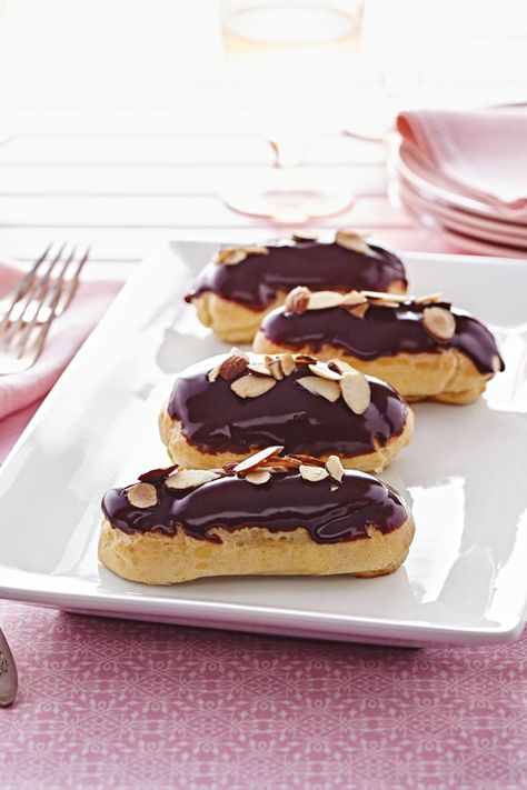 Show up at a party with these chocolate-dipped Éclairs with Almond Pastry Cream, then listen to the oohs and aahs! They only look fancy — they're actually quite simple to prepare with the help of pâte à choux, a thick and sticky pastry dough is typically made from just four ingredients. Mini Peach Pies, Pastry Cream Desserts, Chocolate Tres Leches Cake, Pastry Cream Recipe, Eclair Recipe, Almond Pastry, French Desserts, Pastry Cream, At A Party