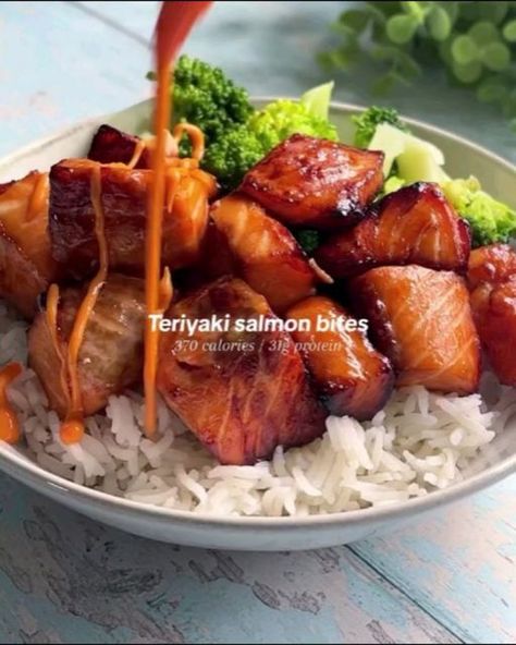 Healthy Eating on Instagram: "Teriyaki salmon bites 🥵 by @veryhungrygreek

Sticky air fried salmon pieces coated in a homemade teriyaki sauce… this was to die for!! 😮‍💨 

Macros
370 calories per portion
31gP / 23gF / 9gC
Serves: 2
 
Shopping list ✍️ 
- 2x salmon fillets, de-skinned 
- 1 tbsp soy sauce 
- 1 tsp dark soy sauce
- 2x tsp honey 
- 1/2 tsp white rice vinegar
Optional garnish: siracha mayo & sesame seeds 

Method
Slice the salmon into bite size pieces then marinade in soy sauce, dark soy sauce, white rice vinegar and honey for at least 20 mins. Air fry on 190C for 6 minutes then using the rest or the marinade brush over the salmon and air fry for a further 2 minutes. Optional, drizzle of siracha mayo and scatter over sesame seeds!

.
.
.
.

#healthyrecipes #easyrecipes #health Teriyaki Salmon Bites, Air Fried Salmon, Salmon Bites Recipe, Salmon Soy Sauce, Salmon Bites, Dark Soy Sauce, Fried Salmon, Teriyaki Salmon, Homemade Teriyaki Sauce