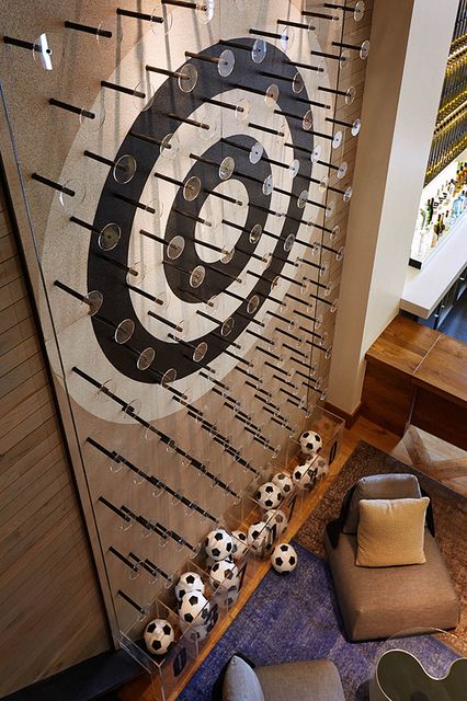 Giant Plinko wall! Wall Game, Creative Retreat, Retro Interior Design, Interactive Walls, Black Wall Clock, Sports Room, Retro Interior, Salalah, Sports Bar