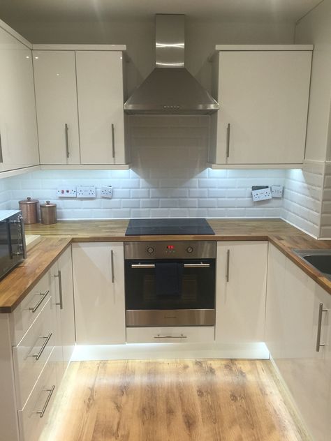 B&Q small kitchen, white, gloss, wooden, subway tiles Kitchen White Gloss Cabinets, Kitchen Ideas White Tiles, Small Kitchen Ideas Square, Small White Gloss Kitchen Ideas, Small Kitchen Wooden Floor, White Kitchen With Tiles, B&q Kitchen, Small Fitted Kitchen Ideas, Small Cream Kitchen