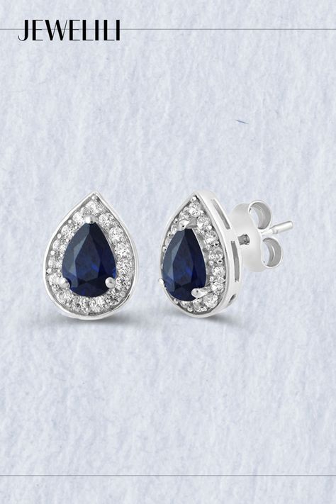 Boost your style statement with these striking Stud Earrings in Sterling Silver, featuring a pear-shaped created blue sapphire paired with a round created white sapphire. These exquisite earrings effortlessly blend evergreen charm with modern sophistication, making them perfect for both casual and formal occasions. Ideal as a thoughtful gift for September birthdays, they celebrate the beauty of the sapphire birthstone in a truly captivating way. Sterling Silver Diamond Earrings, Sapphire Birthstone, Silver Diamond Earrings, Ear Rings, Style Statement, Earrings Sterling Silver, Sterling Silver Earrings Studs, White Sapphire, Silver Diamonds