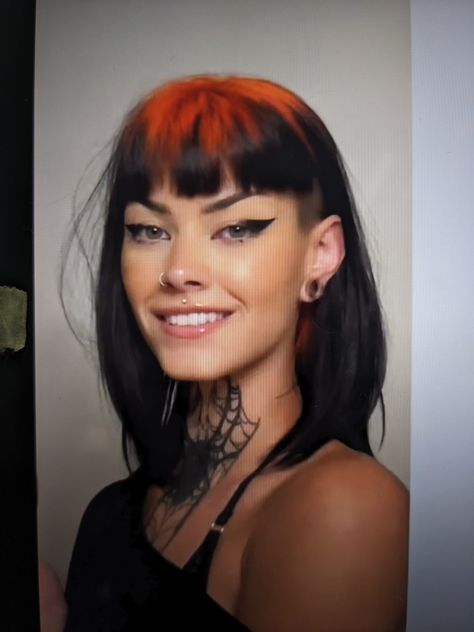 Black shoulder length haircut with orange roots, bangs above the eyebrows, and an undercut Undercut Alt Hair, Short Hair With Bangs And Undercut, Berlin Haircut Woman, Bangs With Side Shave, Baby Bangs With Long Hair, Micro Bangs Shaved Sides, Bangs With Shaved Sides, Undercut With Fringe, Bangs With Undercut