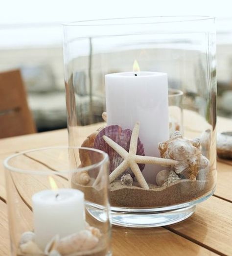 Pillard candles are my favorite candles to use. And these glass candle holder ideas leave room for some beach sand and beach finds! Featured on Completely Coastal. Sailor Decor, Vase Filler Ideas, Beach Centerpieces, Deco Marine, Beach Candle, Beach Crafts, Vase Fillers, Pillar Candle Holders, Seashell Crafts