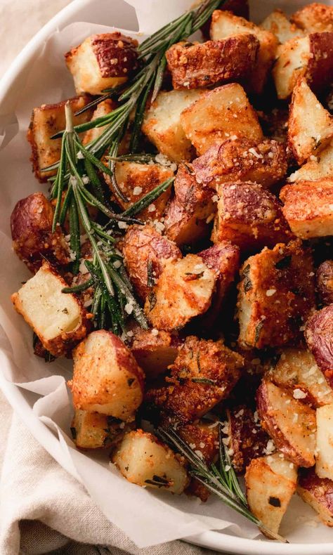 These Parmesan Roasted Red Potatoes with Rosemary are perfectly golden brown and crispy. They are roasted with parmesan and fresh rosemary which is a perfect flavor combination. Crispy Red Potatoes, Parmesan Roasted Red Potatoes, Parmesan Roasted Potatoes, Roasted Red Potatoes, Roasted Potato Recipes, Potato Sides, Walnut Salad, Goat Cheese Salad, Cheese Salad