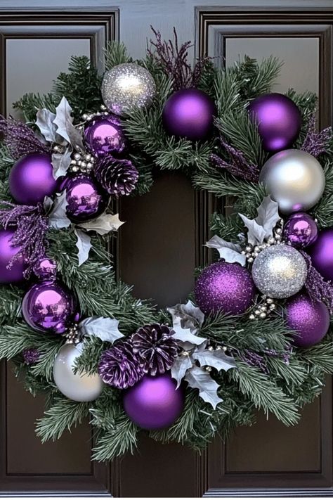 Take your purple and silver theme beyond the tree! Discover how to incorporate this elegant color scheme throughout your entire home for a cohesive holiday look. Some of the links in my articles are affiliate links. If you make a qualified purchase from one of my links I will make a small commission at no cost to you. Thank you for your support!!! Christmas Wreaths Purple, Purple Wreath Christmas, Purple Christmas Decorations Ideas, Christmas Wreath Purple, Purple Christmas Decor Ideas, Purple And Silver Christmas Tree Ideas, Purple And Silver Christmas, Purple Christmas Decor, Purple Christmas Wreath