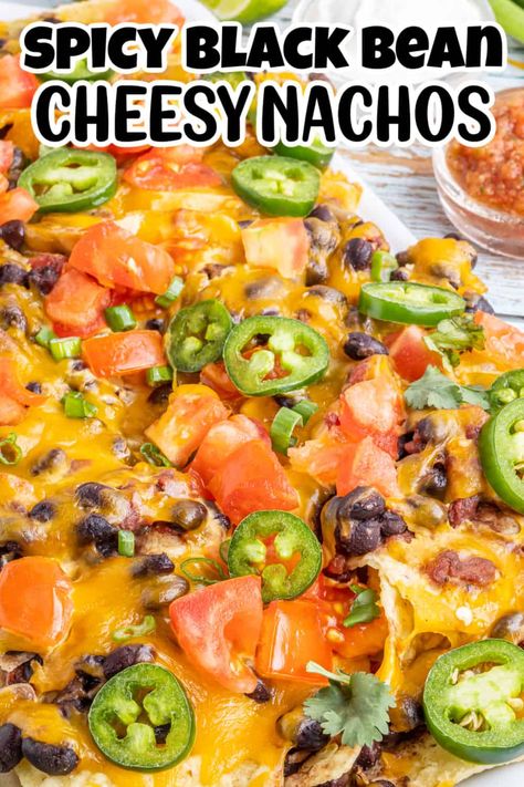 Nachos are a classic snack for just about any occasion – especially if they’re topped with melted cheese and spicy beans! And when you use your oven to bake them on a sheet pan, you have a delicious snack that’s also easy to prepare. That’s why this recipe for spicy black bean nachos is sure to be a hit at any get-together. Everyone will love the crispy chips topped with cheese and a spicy bean mixture, making it perfect for a party. Black Bean Nachos Recipe, Beans For Nachos, Oven Nachos Recipes, Nachos Recipe Vegetarian, Bean And Cheese Nachos, Bean Nachos Recipe, Oven Nachos, Spicy Nachos, Black Bean Nachos