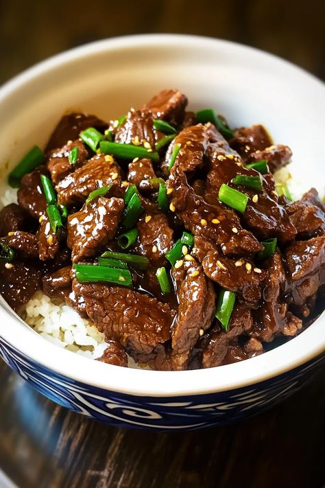 This slow cooker Mongolian beef is packed with bold flavors! Tender beef simmers in a rich, sweet, and savory sauce with a hint of garlic and ginger. It’s a delicious takeout favorite made easy at home, perfect for serving over rice or noodles. Ready to cook? Click for the recipe #slowcookerrecipes #mongolianbeef #beefrecipes #asianfood #easymeals #takeoutathome #comfortfood #weeknightdinner #slowcooked Ribeye Slow Cooker Recipe, Slow Cooker Mongolian Beef, Teriyaki Chicken Rice Bowl, Beef Flank Steak, Teriyaki Chicken And Rice, Brussel Sprout Recipes Roasted, Slow Cooker Recipes Beef, Garlic And Ginger, Mongolian Beef