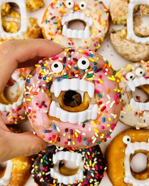 Donut With Vampire Teeth, Monster Donut Ideas, Halloween Monster Donut Treats, Halloween Doughnuts With Teeth, Vampire Donuts Halloween Treats, Doughnuts With Vampire Teeth, Donut Monsters For Halloween, Monster Doughnuts Halloween Treats, Donut Vampire Teeth