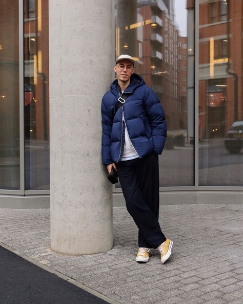 Menswear winter outfit layering inspiration — Arket navy down jacket worn with loose fitting wool Universal Works trousers and mustard yellow Converse 70s sneakers, in Manchester #converse #manchester #ootdmen #menswear #streetwear #sneakers 70s Sneakers Outfit, Yellow Chucks Outfit, Yellow Converse Outfit Men, Mustard Converse Outfit, Converse 70s Sunflower, Converse Yellow Outfit, Converse 70s Outfit Men, Converse 70s Outfit, Chuck 70 Outfit Men