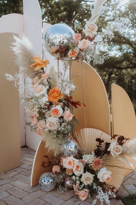 Bohemian Reception Decor, Disco Boho Decor, Disco Balls And Pampas, Arrangements With Pampas, Pampas And Disco Ball Wedding, Disco Ball With Flowers Wedding, 70s Disco Wedding, Boho Wedding Disco Ball, Floral Disco Ball Wedding