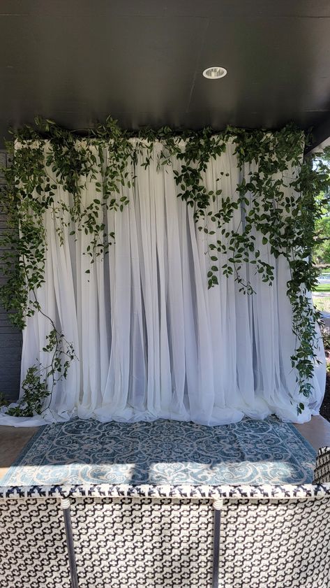 Greenery Garland Backdrop, White Wood Backdrop Wedding, Sheer Backdrop With Greenery, Floral Bridal Shower Decorations Photo Backdrops, Green Photo Backdrop Wedding, White Curtain Backdrop With Greenery, White Backdrop With Greenery, Diy Bridal Shower Photo Backdrop, Hanging Ivy Wedding Decor