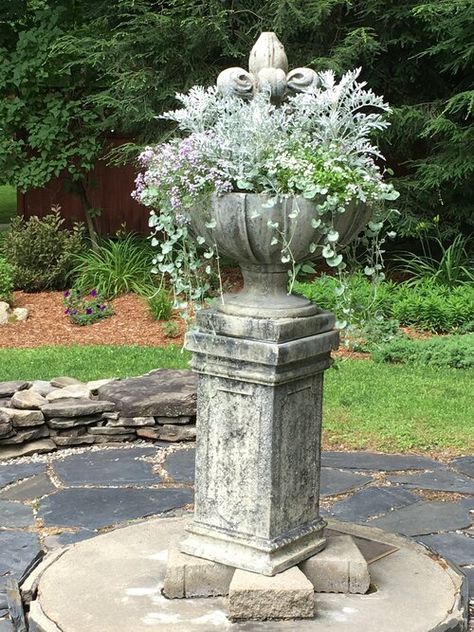 A garden pedestal with an urn of flowers can make a great focal point for a patio or outdoor room #gardenpedestal Garden Pedestal Ideas, Brick Pedestal, Garden Pedestal, Concrete Pedestal, Outdoor Pedestal, Plant Pedestal, Garden Concrete, Self Watering Containers, Living Outside