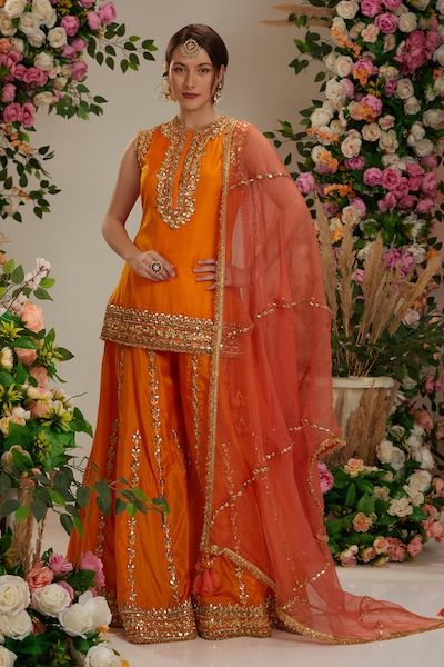 Buy Ivory Cupro Dupion Embroidery Notched Embellished Kurta And Palazzo Set For Women by Niti Bothra Online at Aza Fashions. Kurta With Sharara And Dupatta, Makeup For Orange Outfit, Orange Suits Women Indian, Orange Sharara Suit, Orange Indian Dress, Orange Sharara, Gharara Designs, Lehenga Design, Kurta Sharara