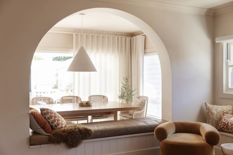 Arched Half Wall, Big Arch Living Room, Arch Living Room Design, Arch Cutout In Wall, Arc Interior Design, Arched Dining Room, Dining Room Arch, Curved Wall Design, Statement Armchair