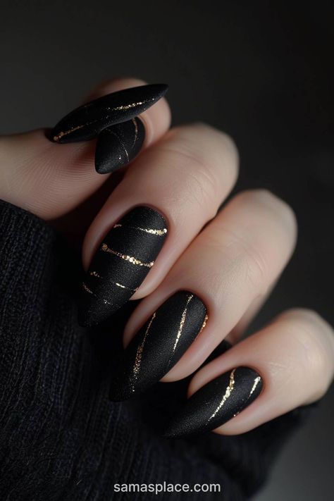 22 Blazing Black Winter Nails Art Ideas and Designs Black Gel Nails Almond Shape, New Years Nail Black, Dark Christmas Nails Almond, Dark Winter Nails With Design, Gothic Short Nail Designs, Nail Art Designs Grunge, Black And Gold Winter Nails, Black Gold Ombre Nails, December Nail Ideas 2024