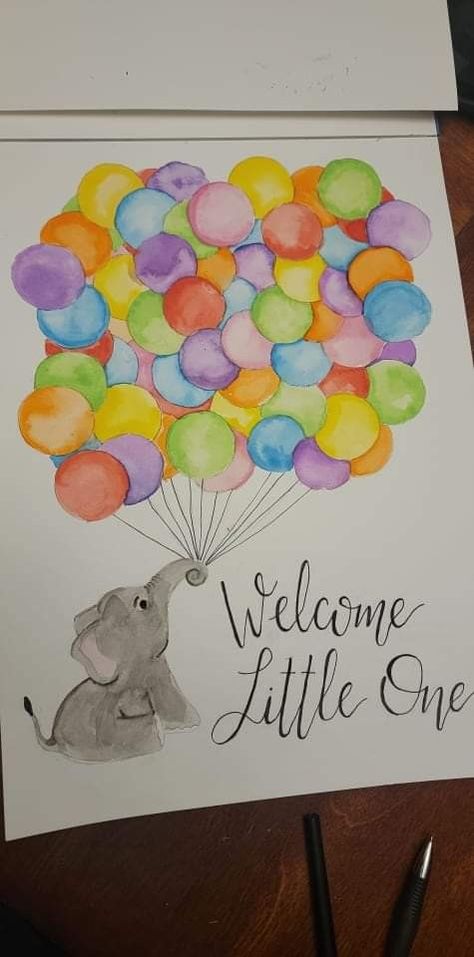 A watercolor painting done on white paper, of an elephant sitting in the bottom left corner, using its trunk to hold a large group of balloons. The balloons are each a different color of the rainbow. Several balloons are full, visible circles, intended for baby shower guests to sign their name. In the bottom right corner, in handwritten script, are the words "Welcome Little One." New Mom Painting Ideas, Baby Girl Painting Ideas, Baby Boy Painting Ideas, Newborn Painting Ideas Canvases, Gender Reveal Ideas Paint Canvas, Baby Canvas Ideas, Canvas Painting For Newborn, Painting For Baby Girl, Baby Painting Ideas Canvases