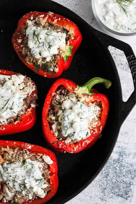 Turkey and Feta Stuffed Peppers with Tzatziki sauce.  The Mediterranean inspired weeknight meal of your dreams.  The peppers are stuffed with ground turkey, lemon rice, fresh dill, feta cheese and is topped with a creamy, herby Tzatziki sauce. #dinner #glutenfree #lowcarb #lunch Feta Stuffed Peppers, Greek Stuffed Peppers, Stuffed Peppers With Rice, Light Lunches, Stuffed Peppers Turkey, Lemon Rice, Weeknight Dinner Recipes Easy, Tzatziki Sauce, Greek Food