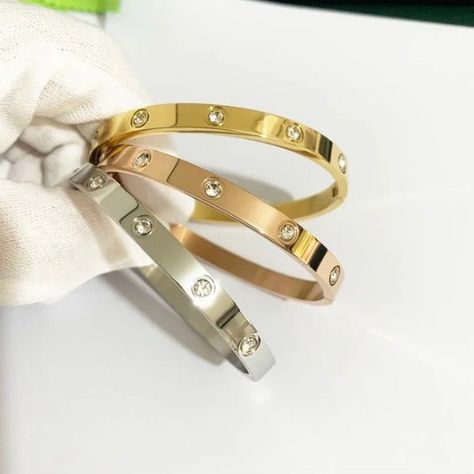 Embrace the elegance of the 2024 new design with the Gold Color Zircon and Cross Nut Nail Bracelet. This stunning piece combines the luxury of zircon with the modernity of the cross and screw design, creating a unique and sophisticated piece of jewellery. Made from high-quality stainless steel with a gold finish, this bracelet offers durability and stylish elegance, making it the perfect accessory for any occasion. Whether for a special event or to add a touch of glamour to your everyday look... Nail Bracelet, Jewelry Photography, The Gold, The Cross, News Design, New Design, Special Event, Gold Finish, Everyday Look