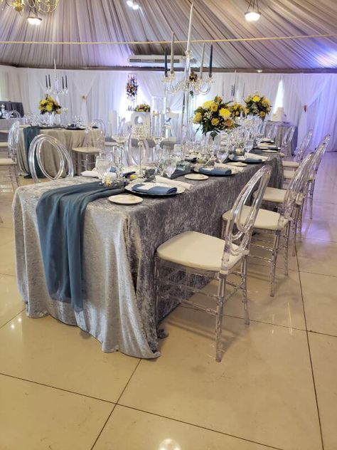 Silver Table Cloth, White Table Decorations, Silver Tablecloth, Velvet Tablecloth, Beaded Candle Holders, Event Decor Ideas, Transparent Chair, Chandelier Candle Holder, Silver Chargers