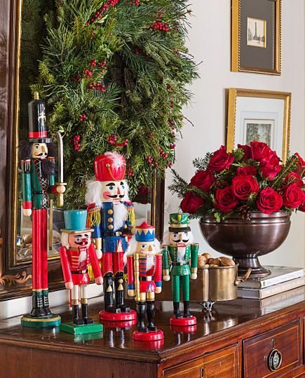 A collection of nutcrackers adds festive spirit to a chest of drawers. More Christmas decorating ideas: http://www.midwestliving.com/homes/featured-homes/holiday-house-tour-tailor-made-holiday/?page=6 How To Display Nutcracker Collection, Decorating With Nutcrackers, Nutcracker Display Ideas, Nutcracker Display, Nutcrackers Display, Classic Nutcracker, Holiday House Tours, Nutcracker Collection, Christmas Side