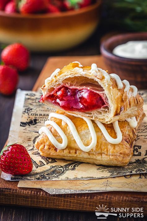 Two strawberry strudels, one cut in half. Strawberry Strudel, Toaster Strudel Recipe, Strawberry Roll, Toaster Strudel, Strudel Recipes, Puff Pastry Dough, Easy Cream, Pastry Crust, Breakfast Pastries