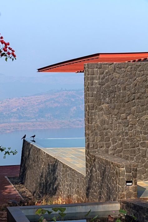 Volcanic stone walls and sculptural skylights are among the features of this holiday home in southwest India by Khosla Associates Volcanic Stone Wall, Khosla Associates, Mountain Architecture, Exterior Wall Cladding, India Architecture, Basalt Stone, Western Ghats, House By The Sea, Volcanic Stone